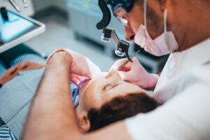 Young man getting dental work done. 